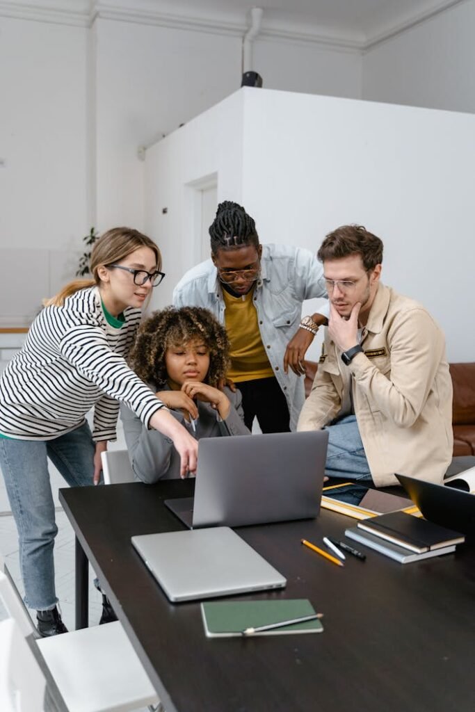 A Group of People Planning while Looking at the Laptop